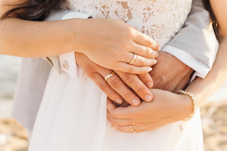 Wedding couple holding hands